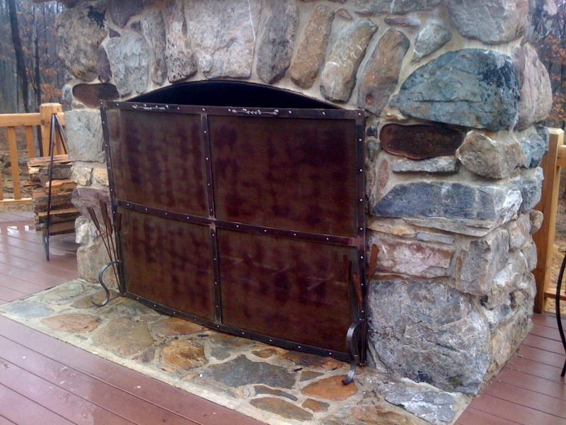 outdoor stone fireplace by Doc Miller